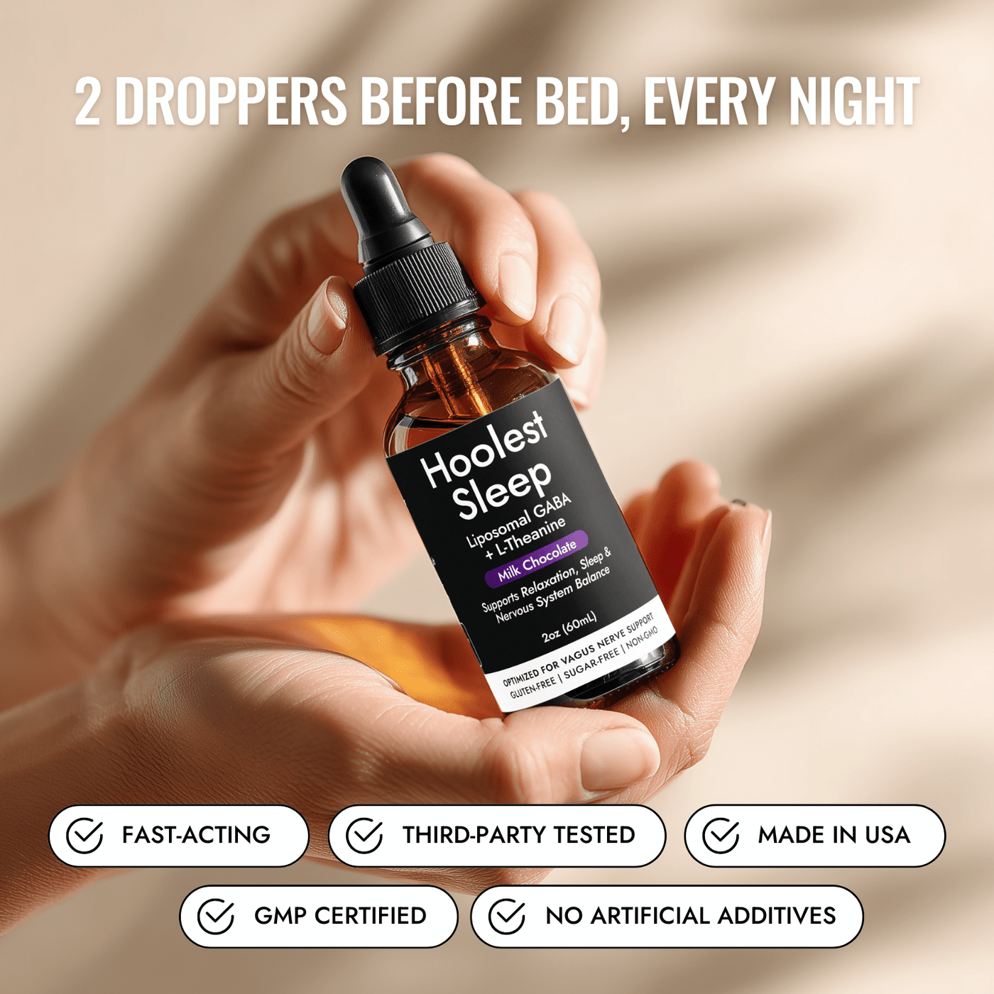 Hand holding Hoolest Sleep bottle, 2 droppers before bed
