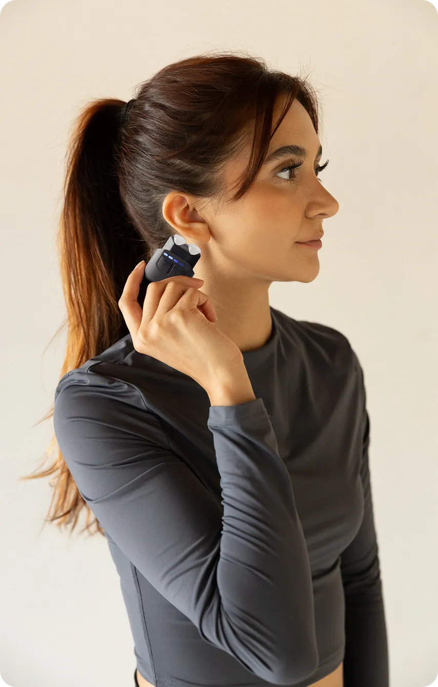 Woman using Hoolest Mini on her neck