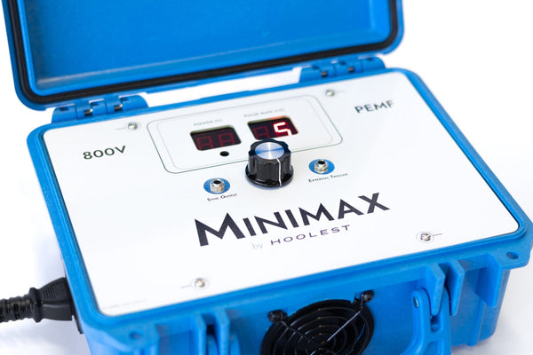 Blue and white MiniMax PEMF device with a digital display and control knob